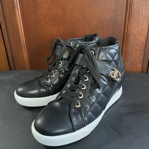 Juicy Couture high top tennis shoes.